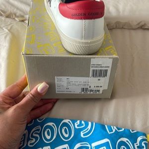 Golden goose worn once kids sneakers size 33 equivalent to a size 3.